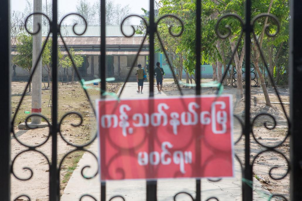 The gate of the high school in Aleh Su village, seen on April 4, has been used as a quarantine centre for Phya Tha Dike village tract since late March. (Thuya Zaw | Frontier)