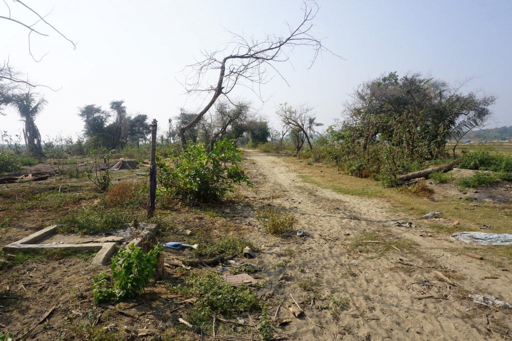 Charred debris of houses and vegetation are seen in the abandoned Rohingya village of Inn Din, in Rakhine State's Maungdaw Township. (Joe Freeman | AFP)