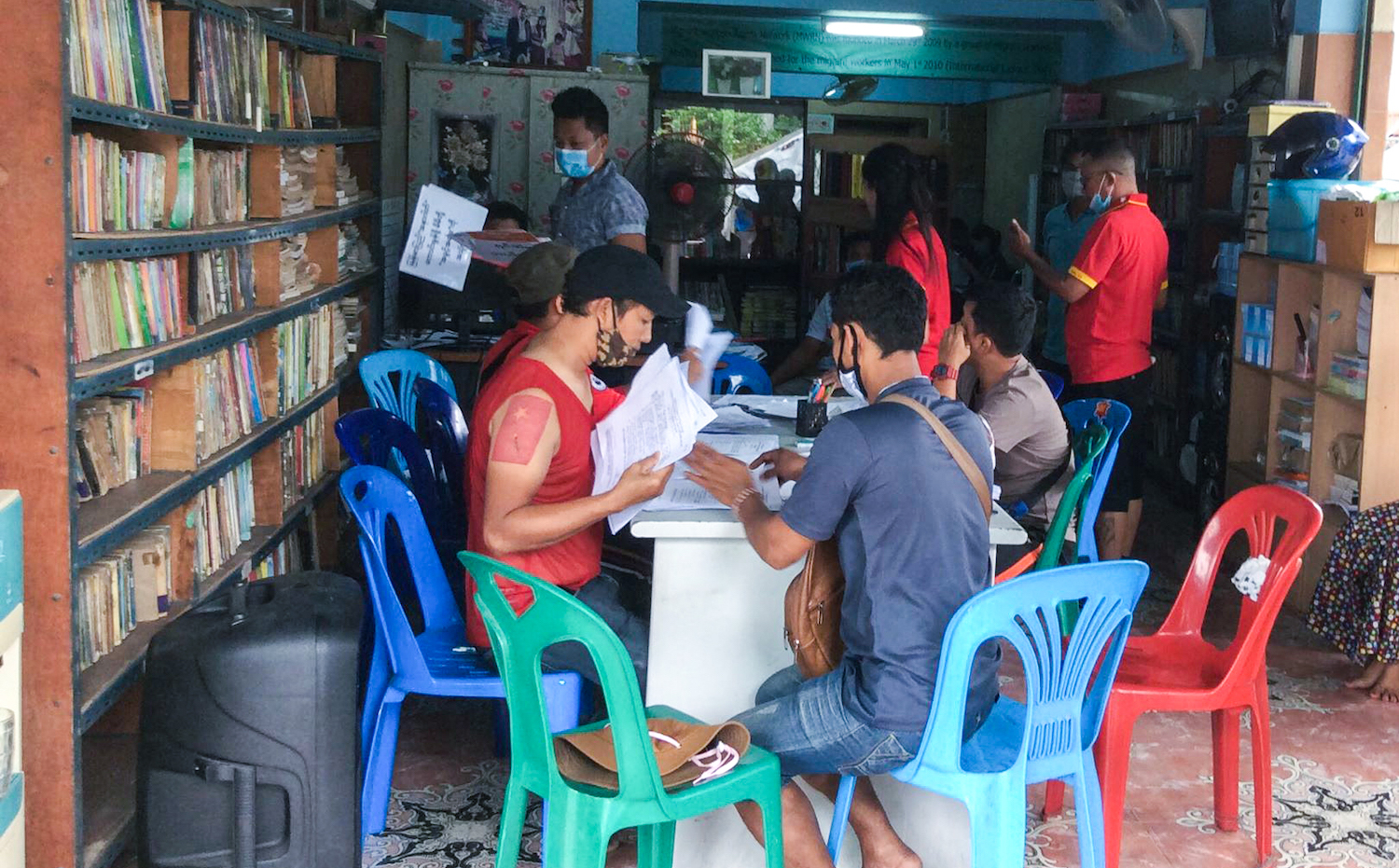 Staff of the Migrant Workers Rights Network in Samut Sakhon sort through advance vote applications by migrant workers ahead of the August 5 deadline. (Supplied)