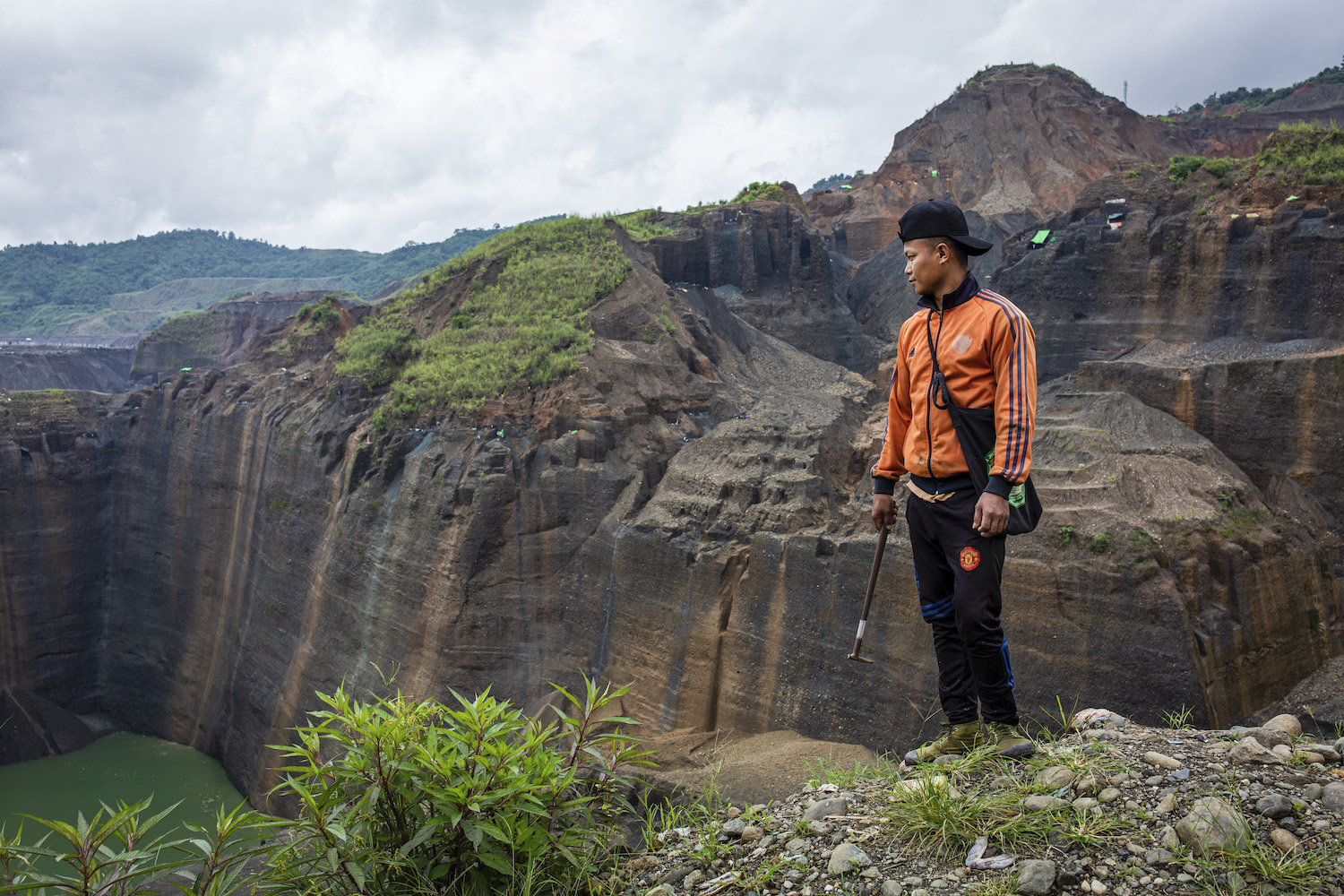 Gum Jat, 31, looks over a jade mining site in Hpakant, Kachin State, where he has worked as a freelance miner for eight years. (Hkun Lat | Frontier)