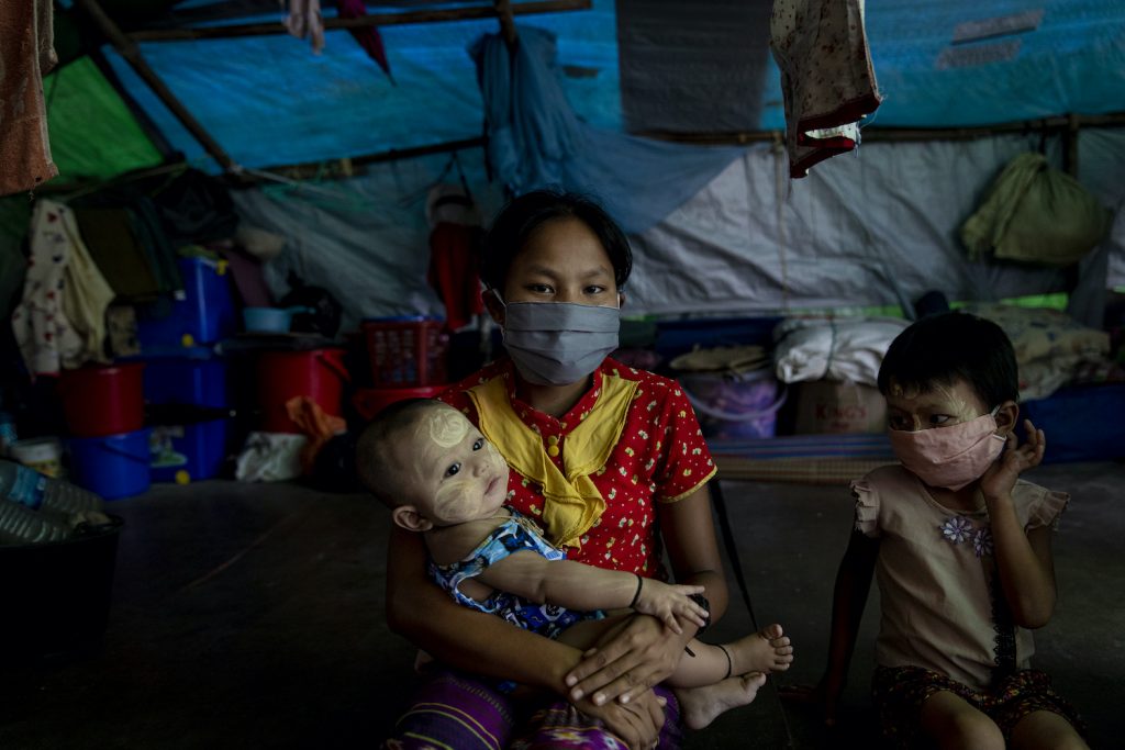 Rakhine IDP family with mask at Shitthaung IDP camp in Mrauk U, Rakhine State on 20 August 2020. Over 200,000 people had been displaced fighting between Arakan Army and Myanmar military in Rakhine State. (Hkun Lat I Frontier)