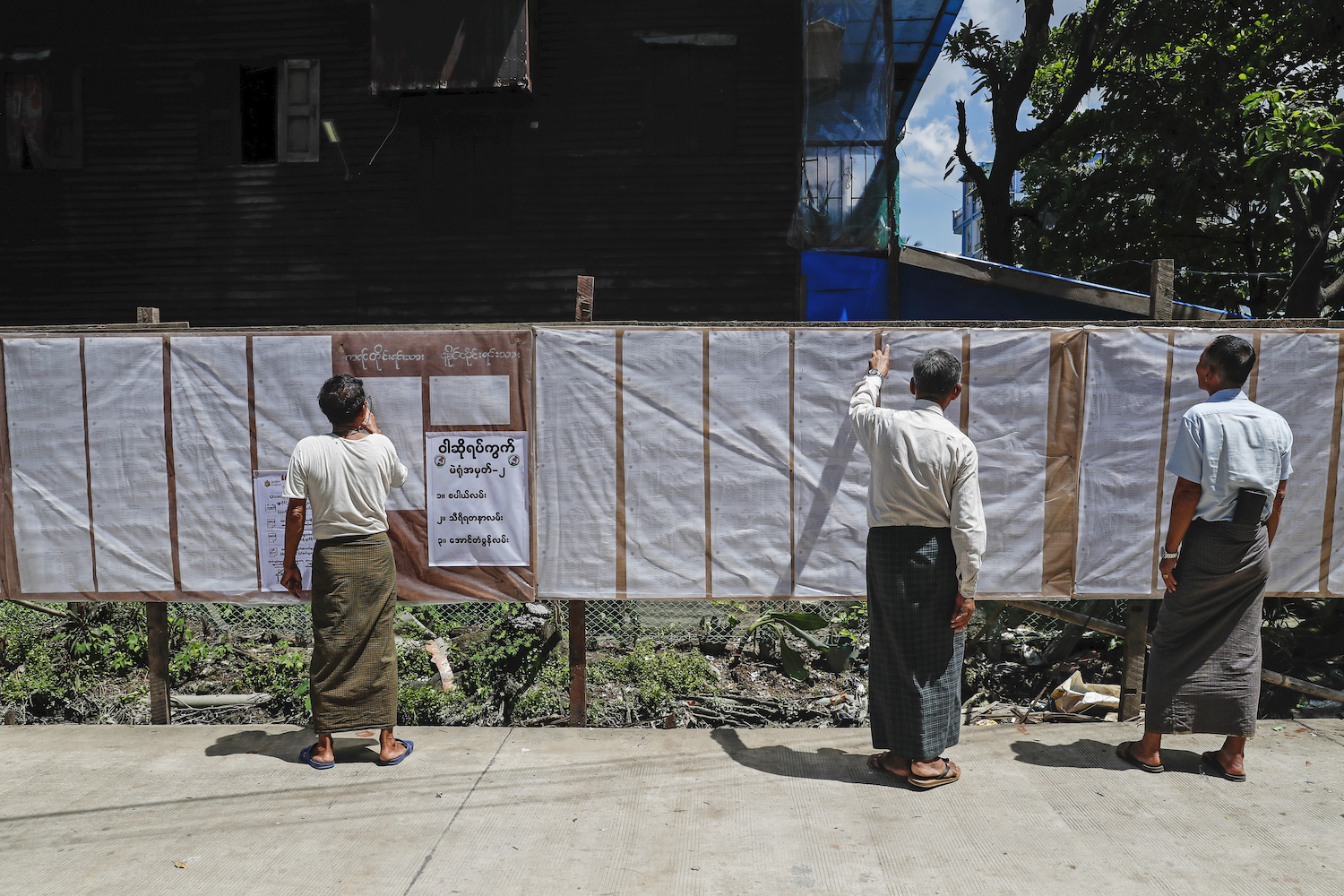 Dawbon Township residents check their details on voter lists on July 25. (Nyein Su Wai Kyaw Soe | Frontier)