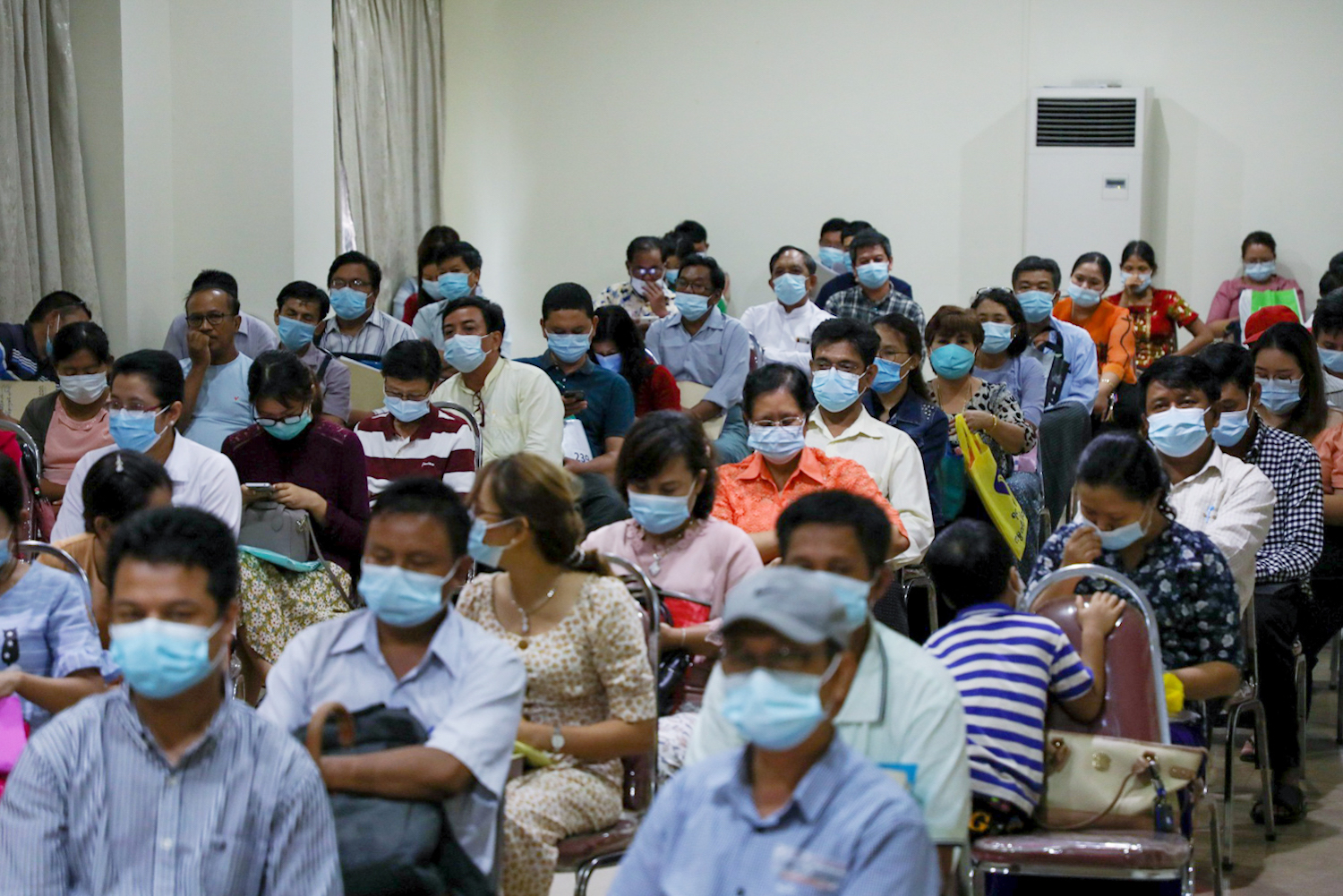 Business owners wait inside the UMFCCI office in Yangon to apply for a low-interest loan from the government on August 7. (Thuya Zaw | Frontier)