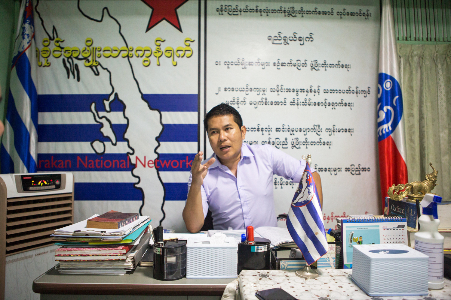 Ko TIn Htoo Aung, Arakan National Network chair and aspiring Rakhine ethnic affairs minister for Yangon Region, speaks to Frontier at his office on August 3. (Thuya Zaw | Frontier)