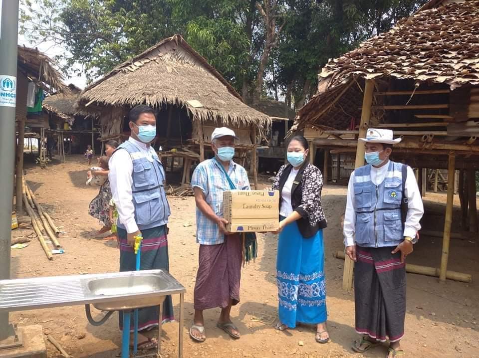 Ministry of Social Welfare, Relief and Resettlement officials deliver COVID-19 supplies to an IDP camp in Kayin State. (Ministry of Social Welfare, Relief and Resettlement Facebook)