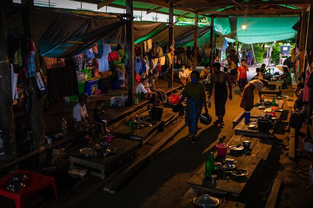 IDPs prepare dinner at a camp in Mrauk-U Township. (Hkan Lat | Frontier)