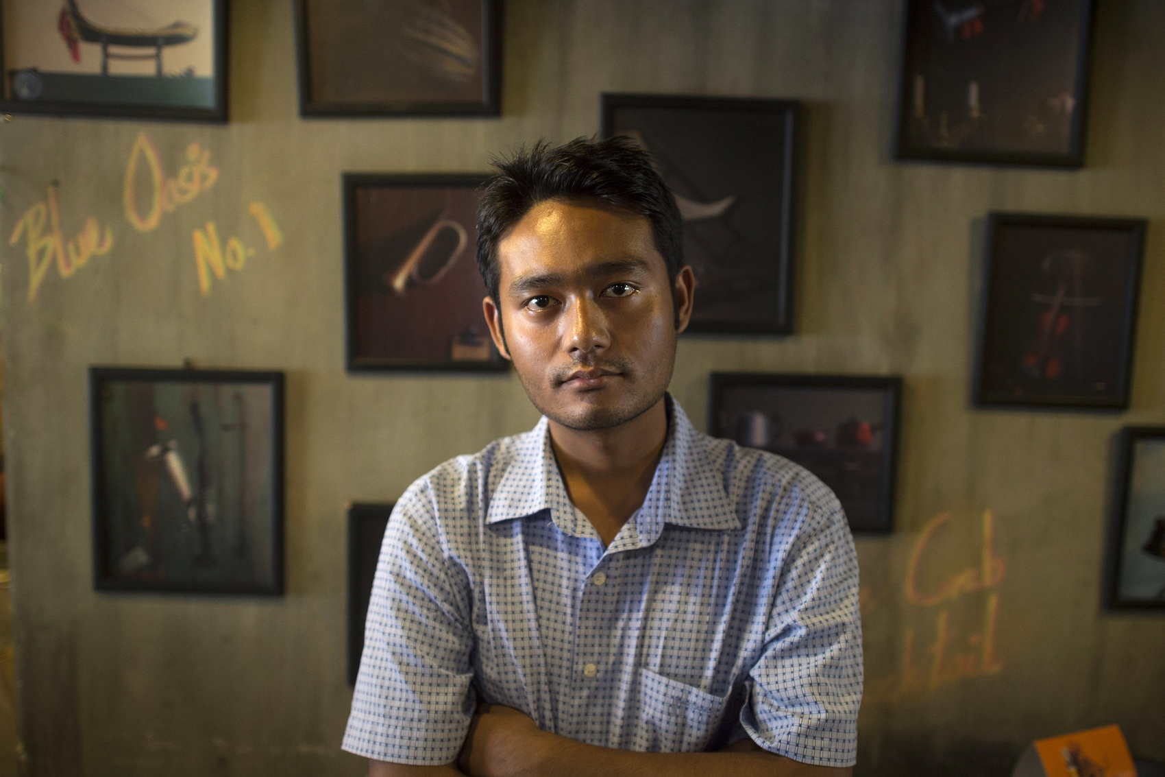 This picture taken on March 28, 2017 shows poet and freedom of expression activist Maung Saungkha posing in Yangon. On September 4 a verdict will be announced in the government's case brought against him under the Peaceful Assembly Law for protesting an ongoing internet blackout in northern Rakhine State. (AFP)