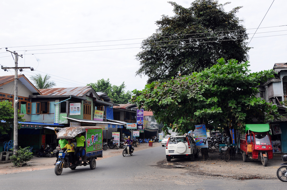 A three-wheeled motorbike taxi cruises the streets of downtown Myitkyina on October 5, 2015. Support for the NLD ran high then, but it has since waned among ethnic groups in Kachin State. (Steve Tickner)