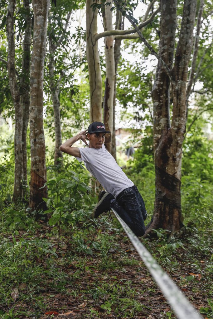 Ko Ye Win Tun performs acrobatic tricks on his slackline – what practitioners call "tricklining." (Nyein Su Wai Kyaw Soe | Frontier)