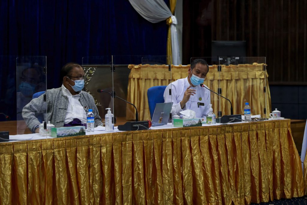 Director General of the Department of Medical Research Dr Zaw Than Tun, right, speaks at a conference on the use of convalescent plasma to treat COVID-19 on August 20, as Dr Rai Mra listens. (Nyein Su Wai Kyaw Soe | Frontier)