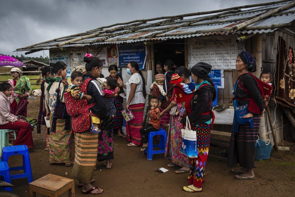 Ta’ang residents of an IDP camp in Kutkai Township wait to receive nutrition support for their children at a clinic. (Hkun Lat | Frontier)