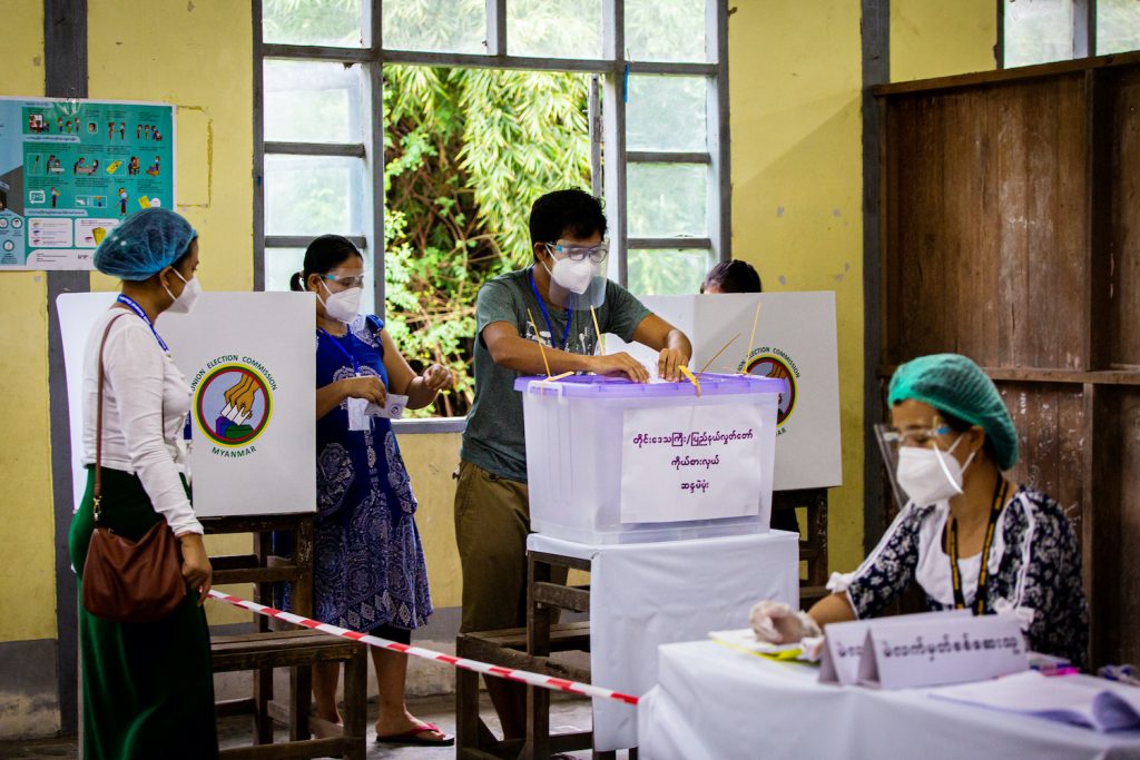 A man casts his vote at a polling station in South Okkalapa Township in Yangon on November 8. (Hkun Lat | Frontier)