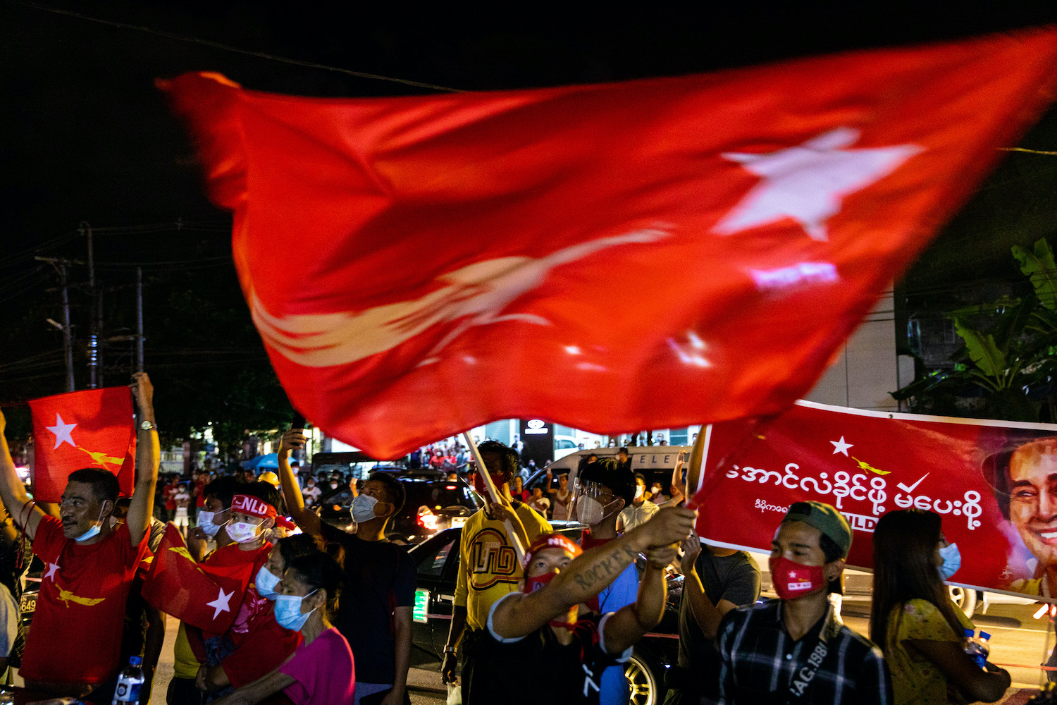 NLD supporters celebrate the party's electoral landslide in front of the party's Yangon headquarters November. (Hkun Lat | Frontier)