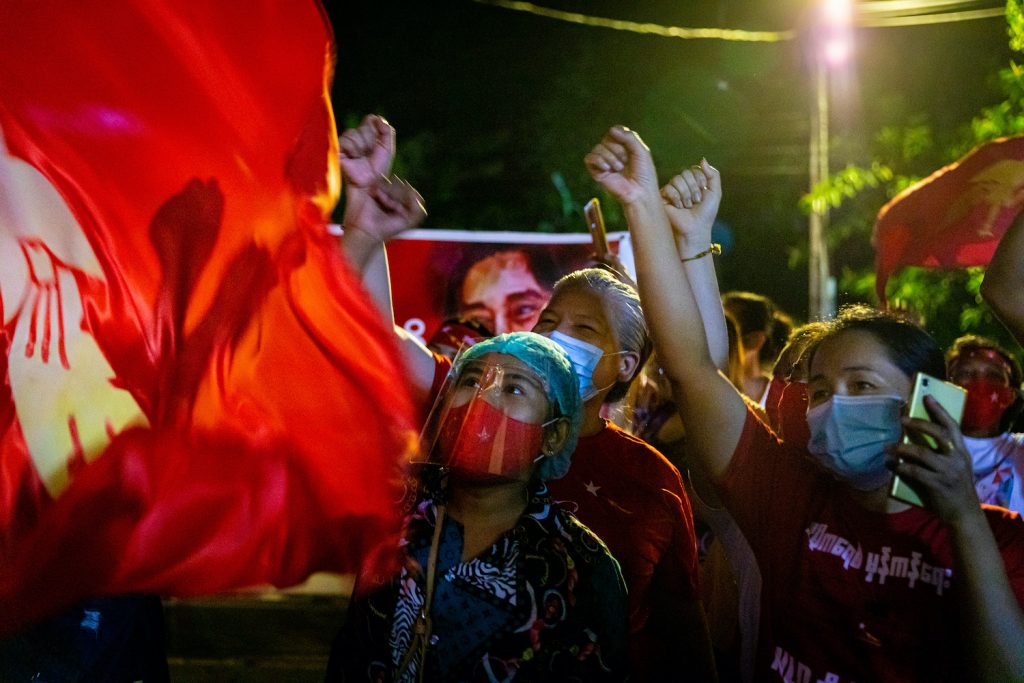 National League for Democracy supporters celebrate in front of the party's head office in Yangon on election night. (Hkun Lat | Frontier)