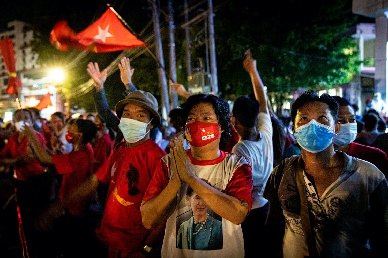 National League for Democracy supporters celebrate news of electoral victory in front of the party's Yangon headquarters on the evening of November 8. (Hkun Lat | Frontier)