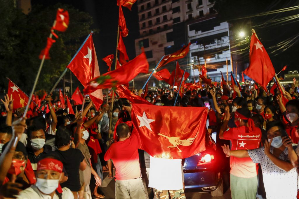 NLD supporters celebrate outside the party's Yangon headquarters on November 9. (Nyein Su Wai Kyaw Soe | Frontier)