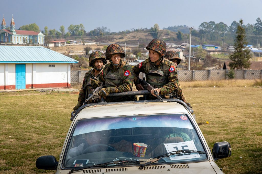 Tatmadaw soldiers in a car during a military-arranged trip in March to show off seized drugs in Lwe Kham village, Kutkai Township, northern Shan State. (Hkun Lat | Frontier)