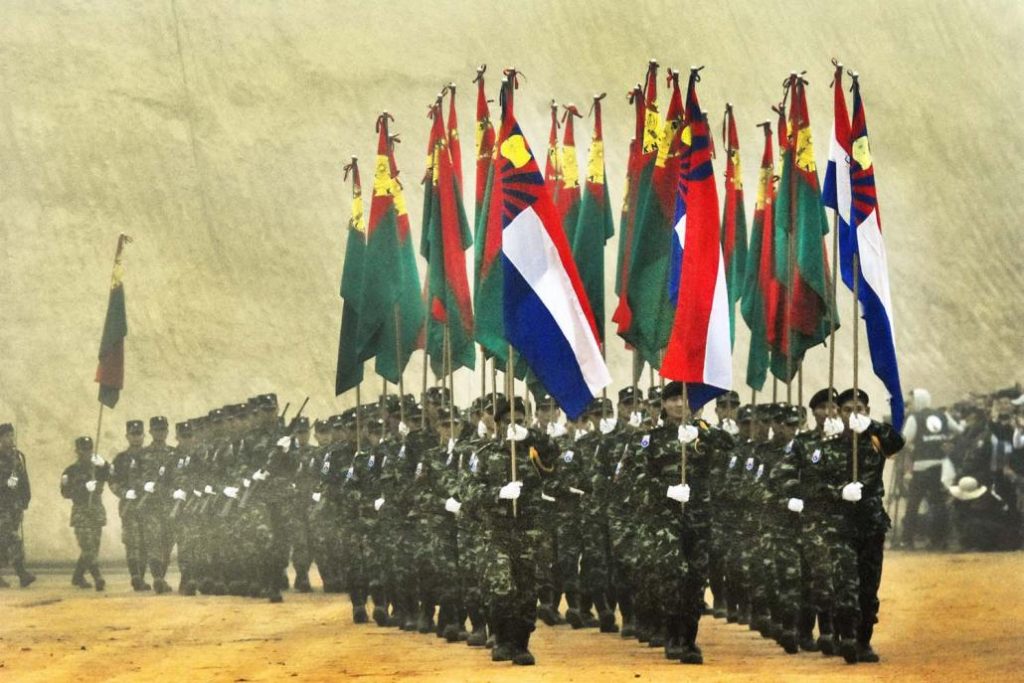 KNLA troops enter the parade ground at Klo Yaw Lay, where KNU’s Seventh Brigade is headquartered, for a Revolution Day ceremony on January 31, 2019. (Steve Tickner | Frontier)