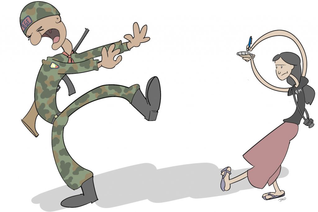 A reporter and a soldier from the Kayin State Border Guard Force.