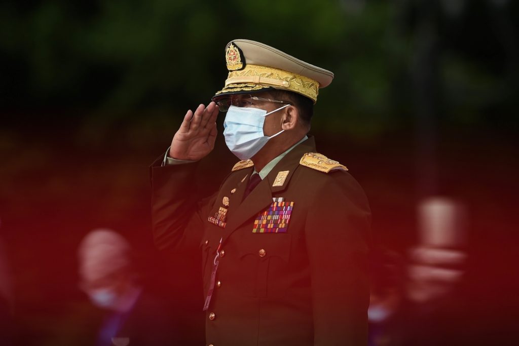 Senior General Min Aung Hlaing salutes during a Martyrs' Day ceremony in Yangon on July 19, 2020. (AFP)