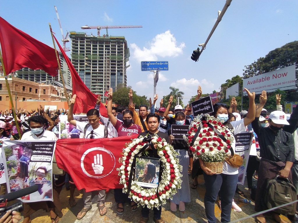 Protesters hold a memorial service for Ma Mya Thwet Thwet Khine in downtown Yangon this morning. (Frontier)