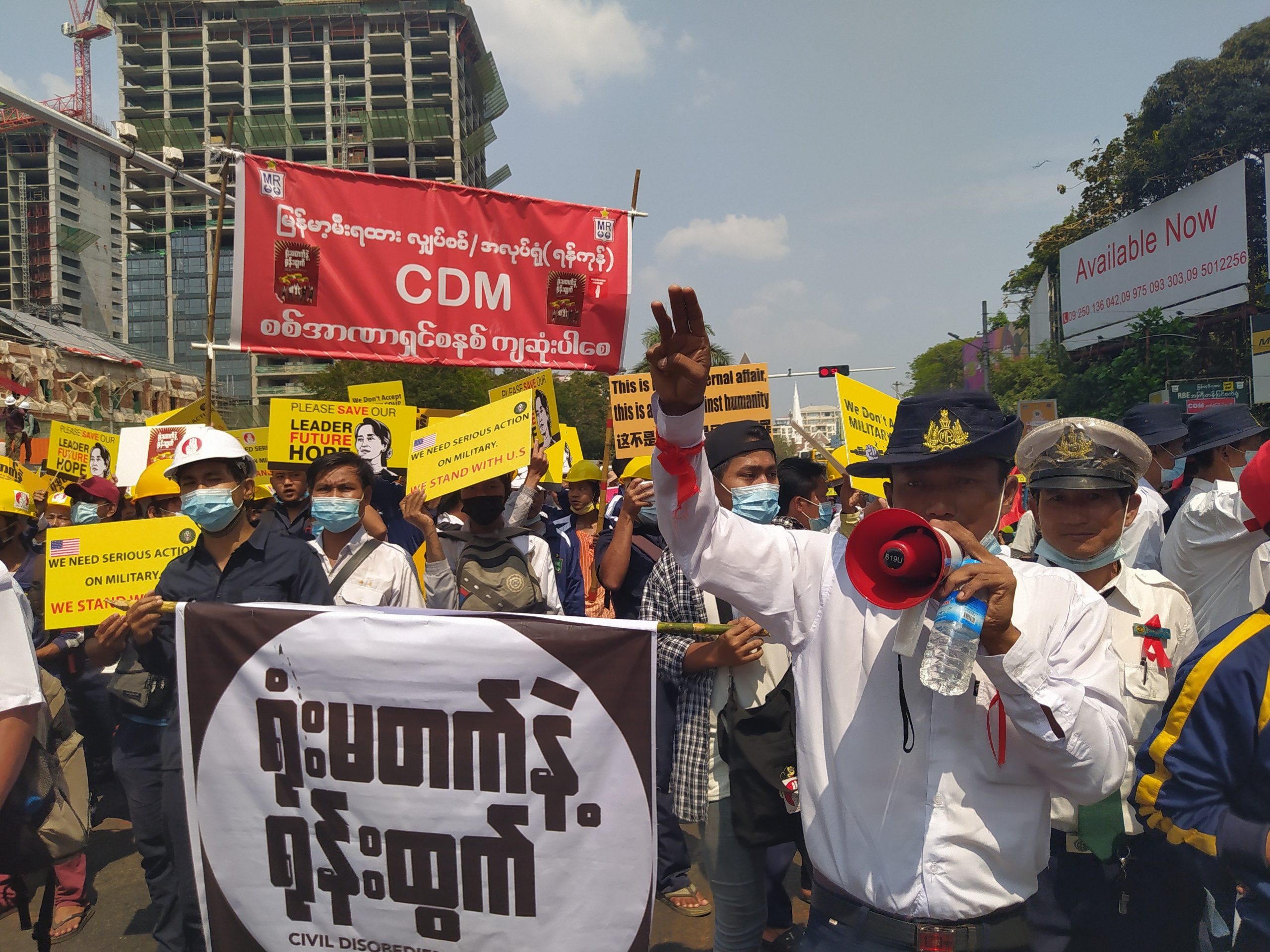 Protesters gather to denounce military rule at the junction of Sule Pagoda and Bogyoke Aung San roads in downtown Yangon. (Frontier)