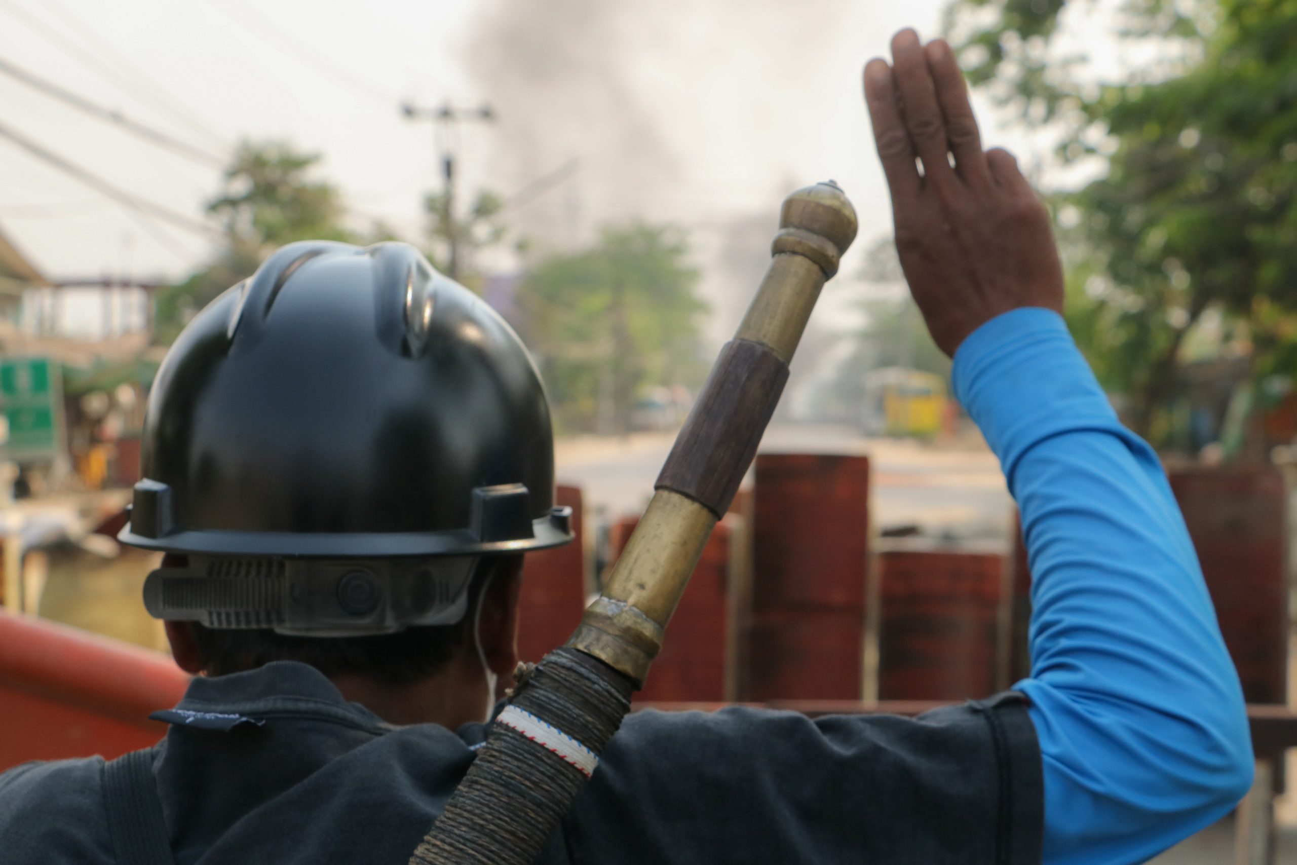 A South Dagon resident mans a barricade in late March, shortly before security forces launched a deadly crackdown. (Frontier)