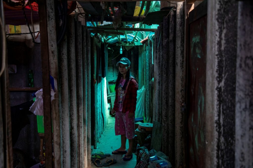 Ma Su Myat Nwe, pictured at her Hlaing Tharyar hostel, says she has not been able to find new work since being laid off by the Fu Tet Li garment factory in February. (Frontier)