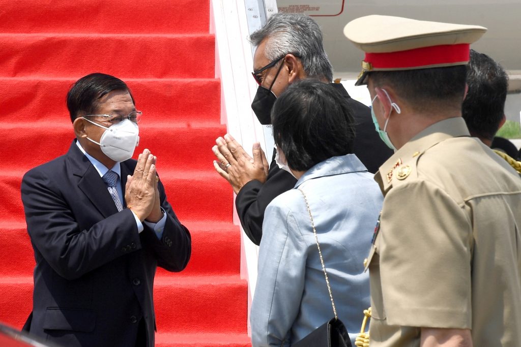 Senior General Min Aung Hlaing (L) is greeted on his arrival at Jakarta's Soekarno-Hatta international airport on April 24 to attend a Association of Southeast Asian Nations summit on the Myanmar crisis. (Indonesian Presidential Palace / AFP)