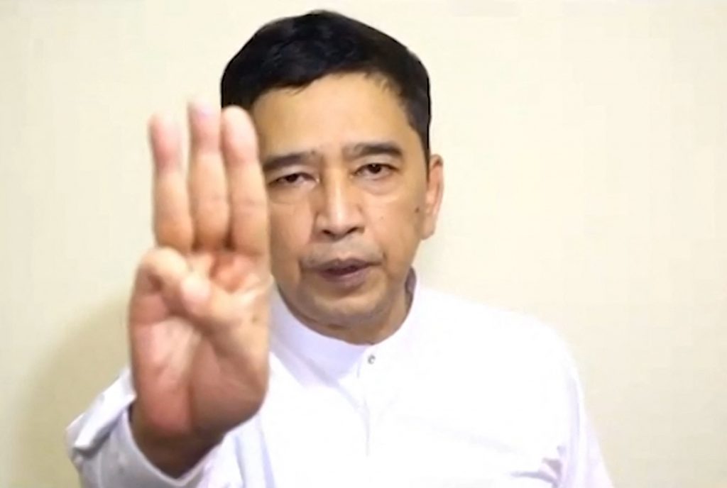 Activist Min Ko Naing holds up the three-finger salute while announcing the formation of a new National Unity Government from an undisclosed location in a video released by the Committee Representing the Pyidaungsu Hluttaw on April 16. (CRPH / AFP)