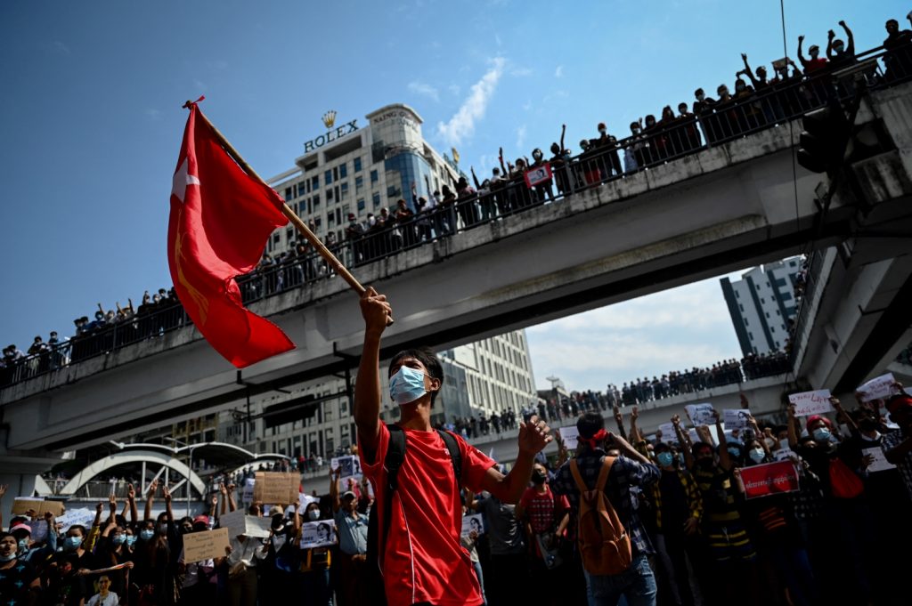 An anti-coup demonstration in downtown Yangon on February 8. Due to bloody crackdowns by security forces, the mass street protests of February have given way to flash-mob demonstrations in cities and towns and guerrilla conflict in the countryside. (AFP)