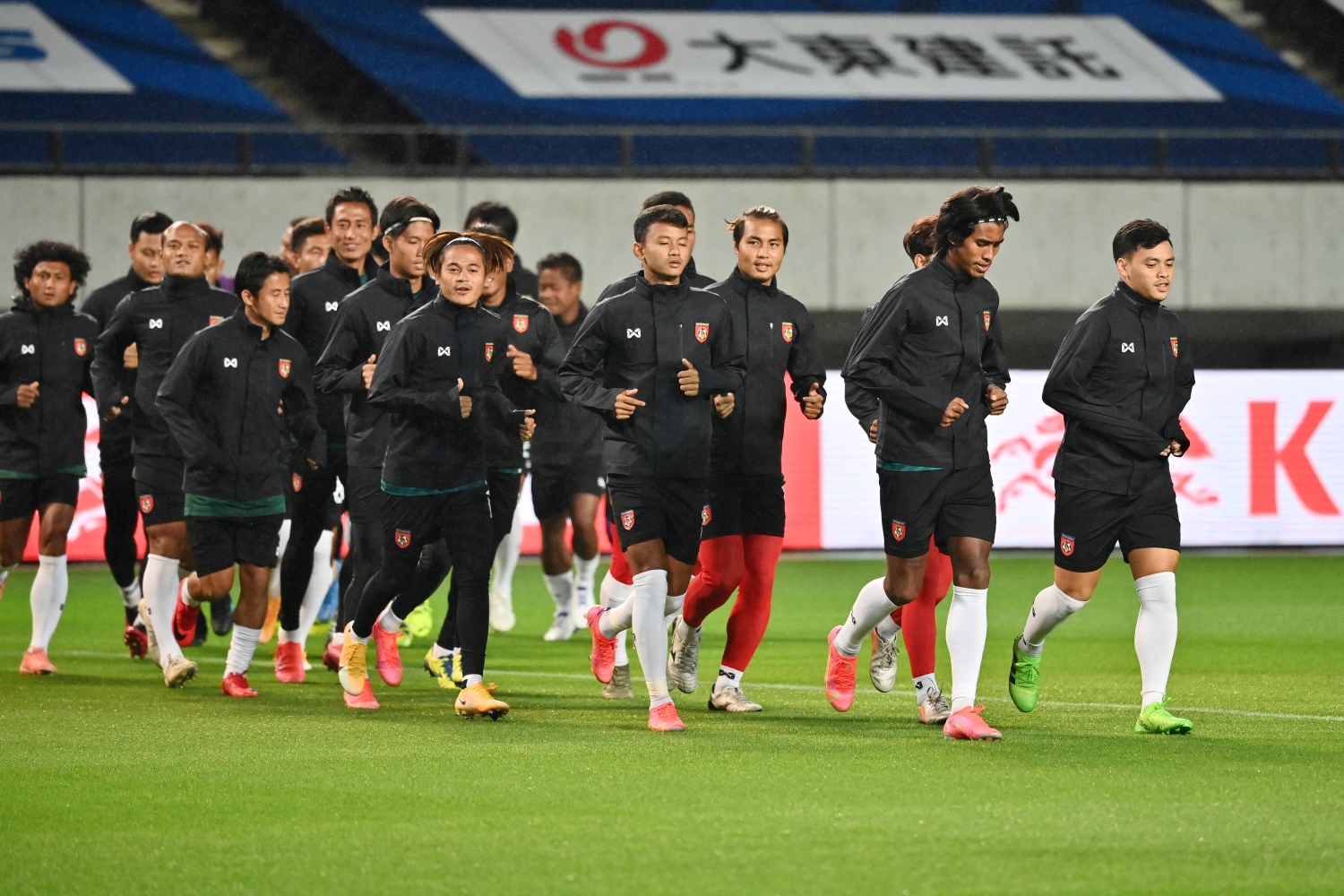 Members of Myanmar's national team take part in a training session ahead of their match against Japan, at Fuku-ari stadium in the Japanese city of Chiba on May 27. (AFP)