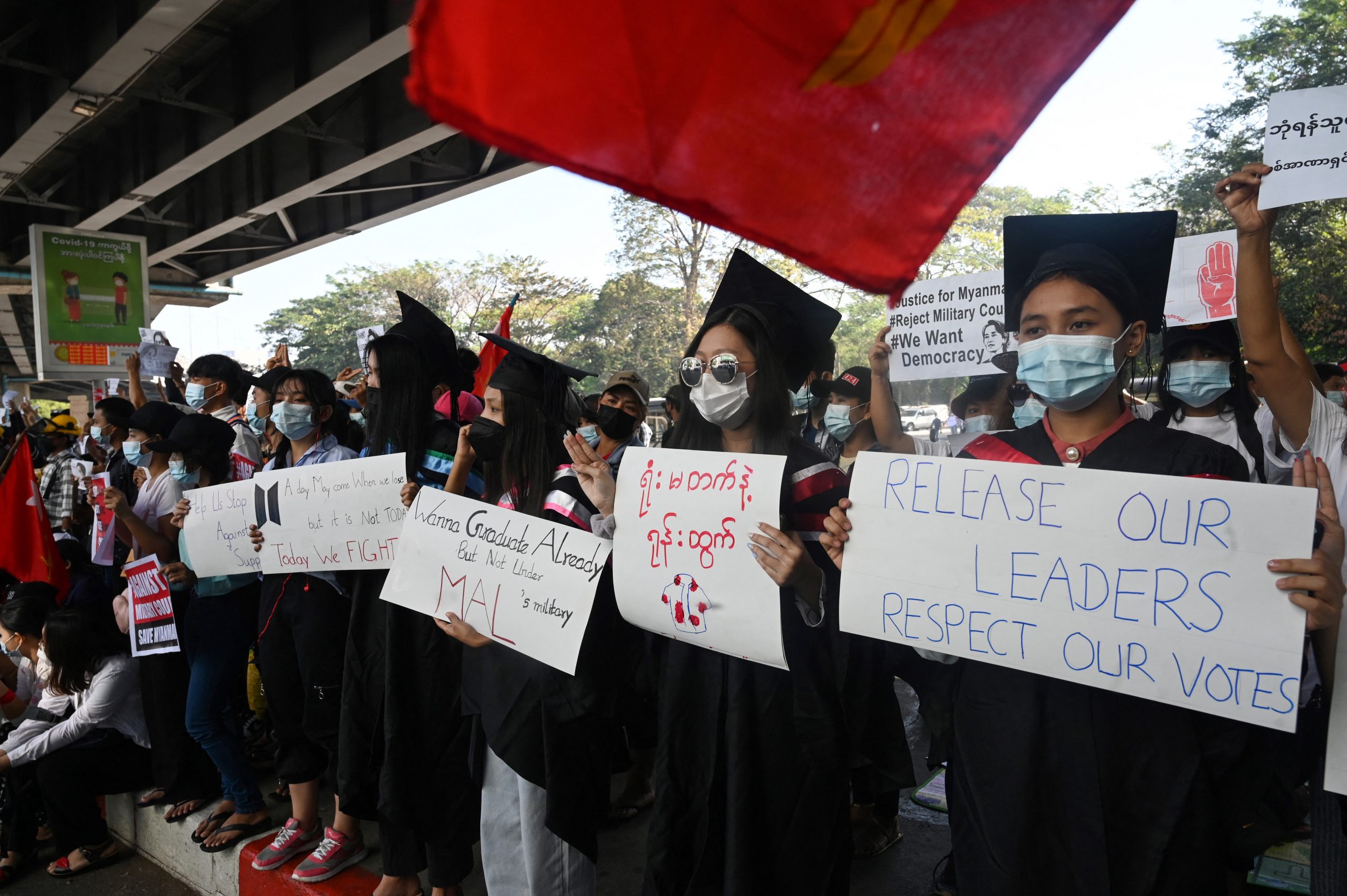 Protesters in school graduation clothing take part in a demonstration against the military coup in Yangon in February. (Frontier)