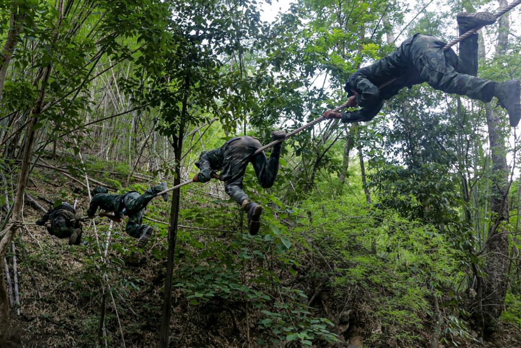 Anti-coup activists, many of whom come from Myanmar's cities, undergo basic military training in KNU territory in the jungles of Kayin State bordering Thailand. (AFP)