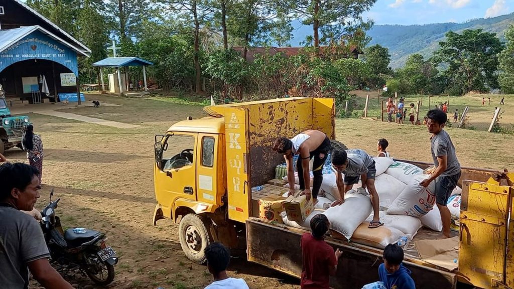 Scarce supplies for people displaced by conflict are unloaded on May 24 at a camp set up in a church compound in Lukse village of Mindat Township. (Supplied)