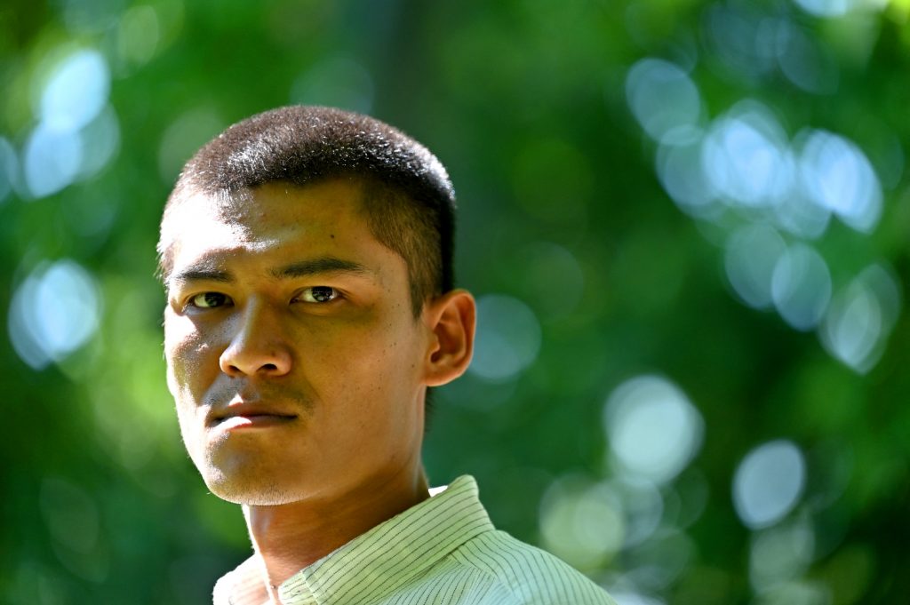 Mratt Kyaw Thu poses at the Retiro park in Madrid on June 7. The Myanmar reporter travelled to Spain on June 1 to seek asylum after fleeing the military junta in Yangon. (AFP)