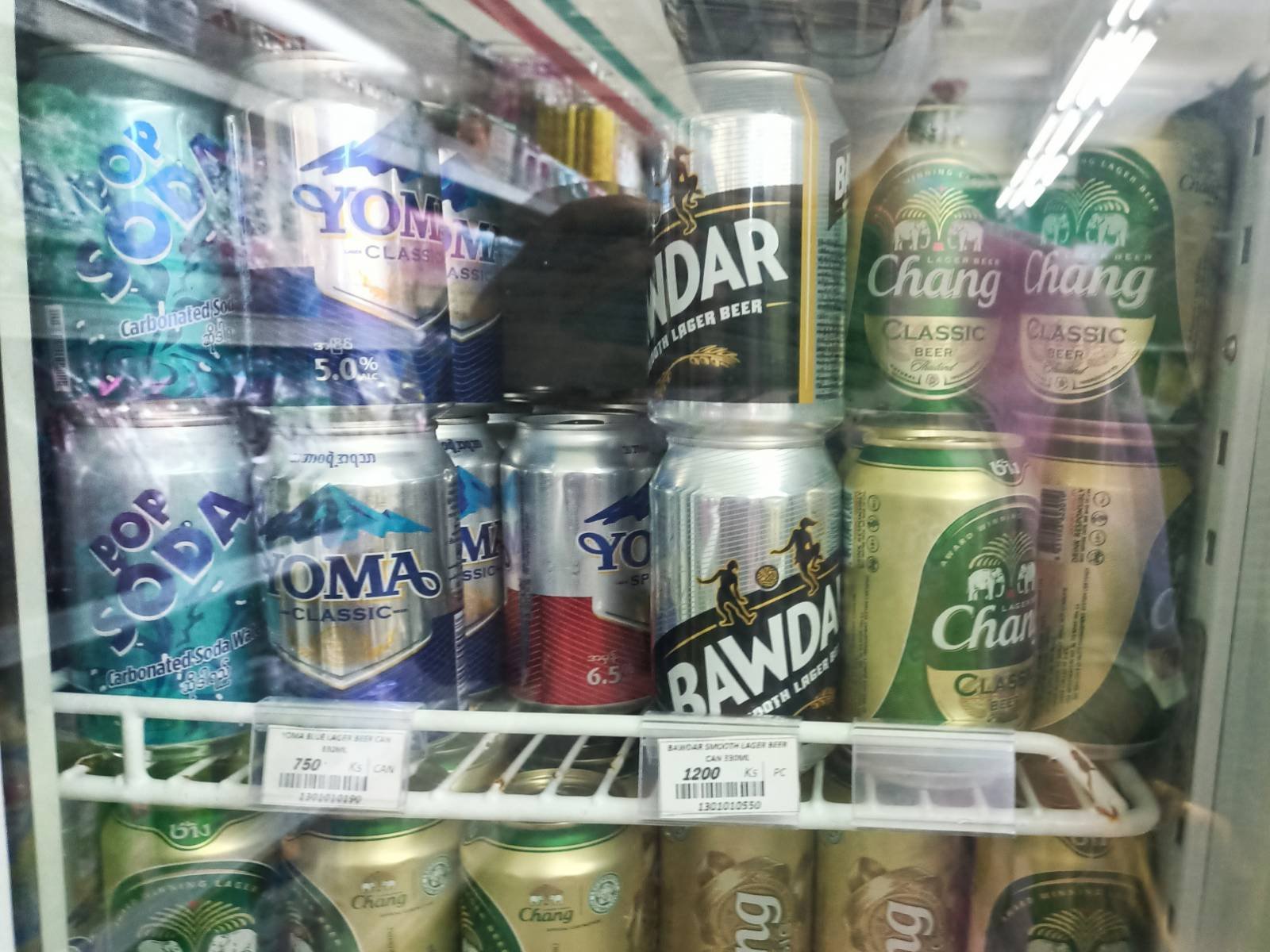 Various brands of beer in a convinence store fridge. (Frontier)