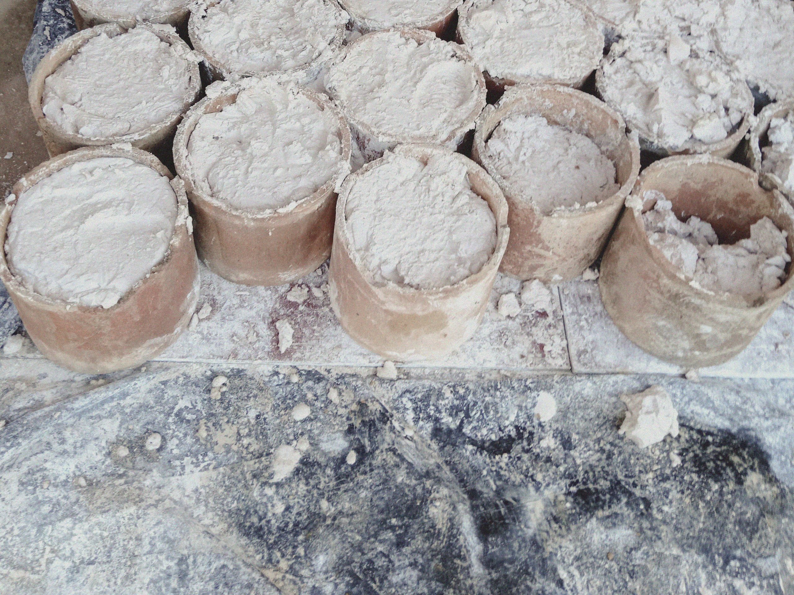 Pots containing rare earths at a mine site near Pangwa in Kachin State's Chipwi Township.