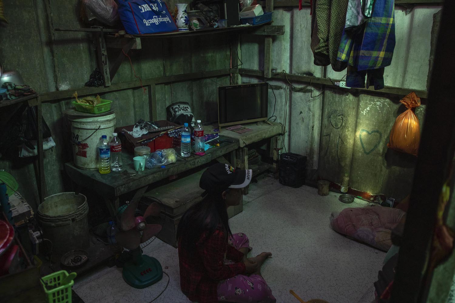 A former factory worker who lost her job pictured in her hostel dormitory in Hlaing Tharyar Township in 2021. (Frontier)