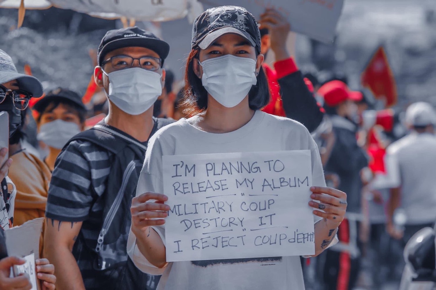 Thazin Nyunt Aung attends an anti-military protest shortly after the coup with Phyo Zayar Thaw. (Supplied)