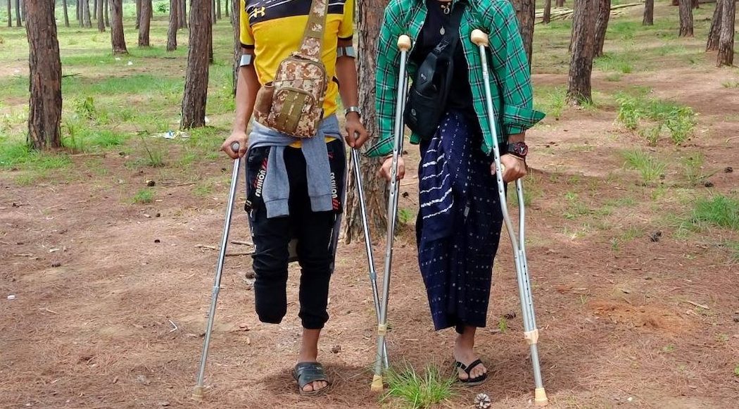 Henry and another member of the Karenni Nationalities Defense Force, injured by landmines planted by the Myanmar military. (Supplied)