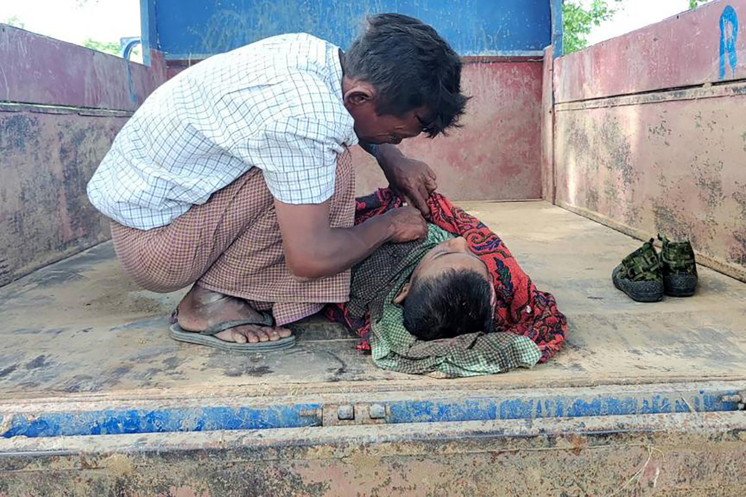 A young victim of an air strike on a school in Tabayin Township on September 17 after an attack on a village by a military helicopter. (AFP)