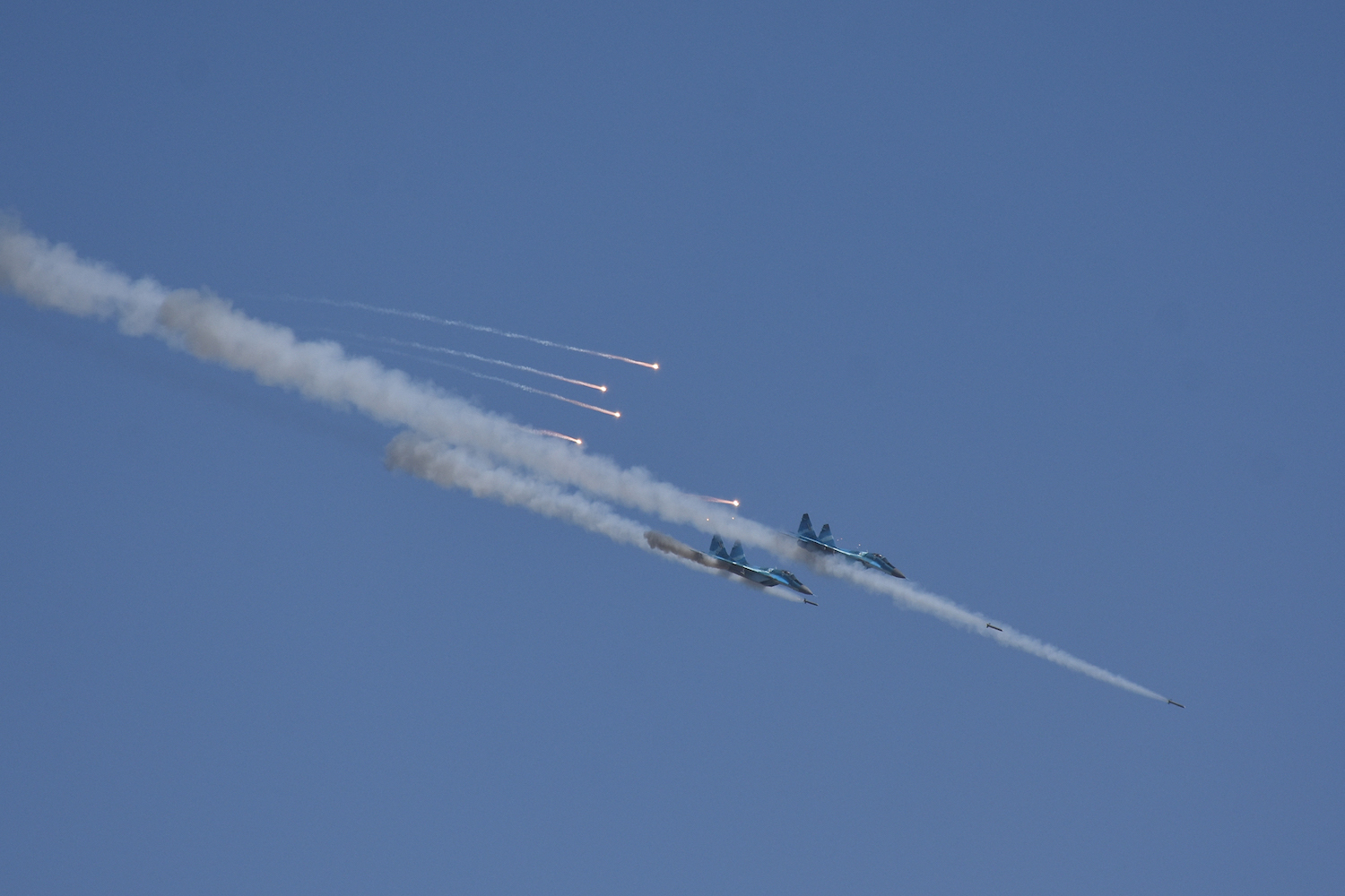 Two Myanmar military fighter jets fire missiles during exercises in Magway in 2019. (AFP)