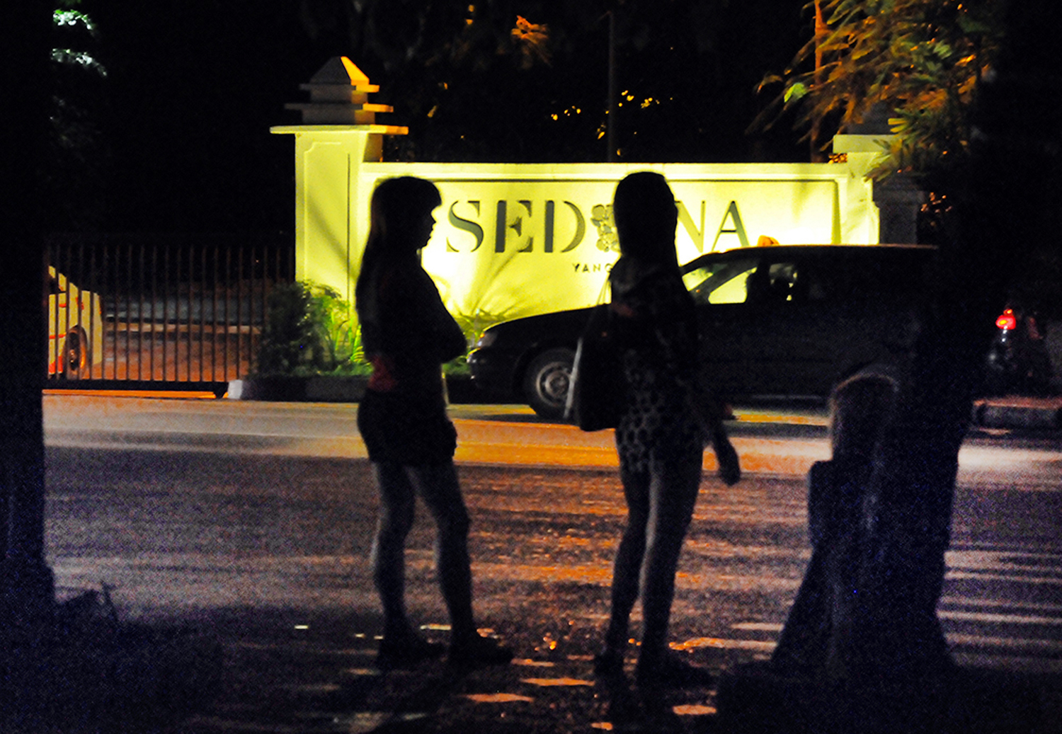 Sex workers wait for customers near the luxury Sedona Hotel in Yangon. (Frontier)