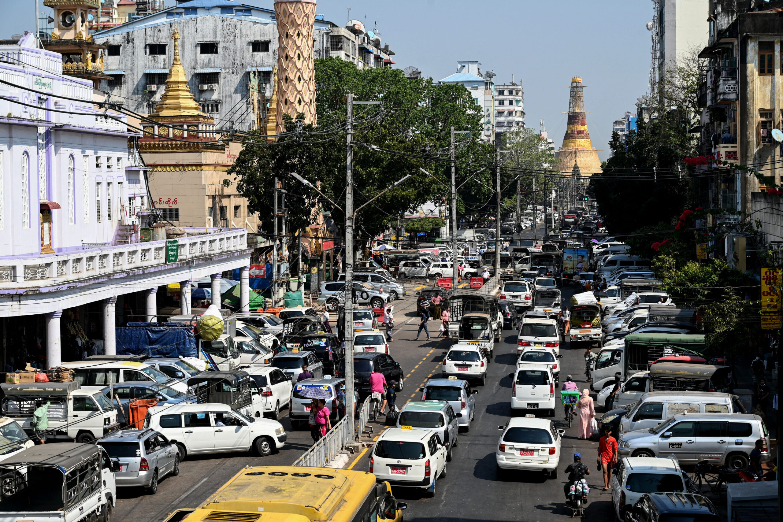 Traffic along Yangon's Mahabandoola Road, with Sule Pagoda in the background, on January 31, 2023. It's two years since the military seized power on February 1, 2021. (AFP)