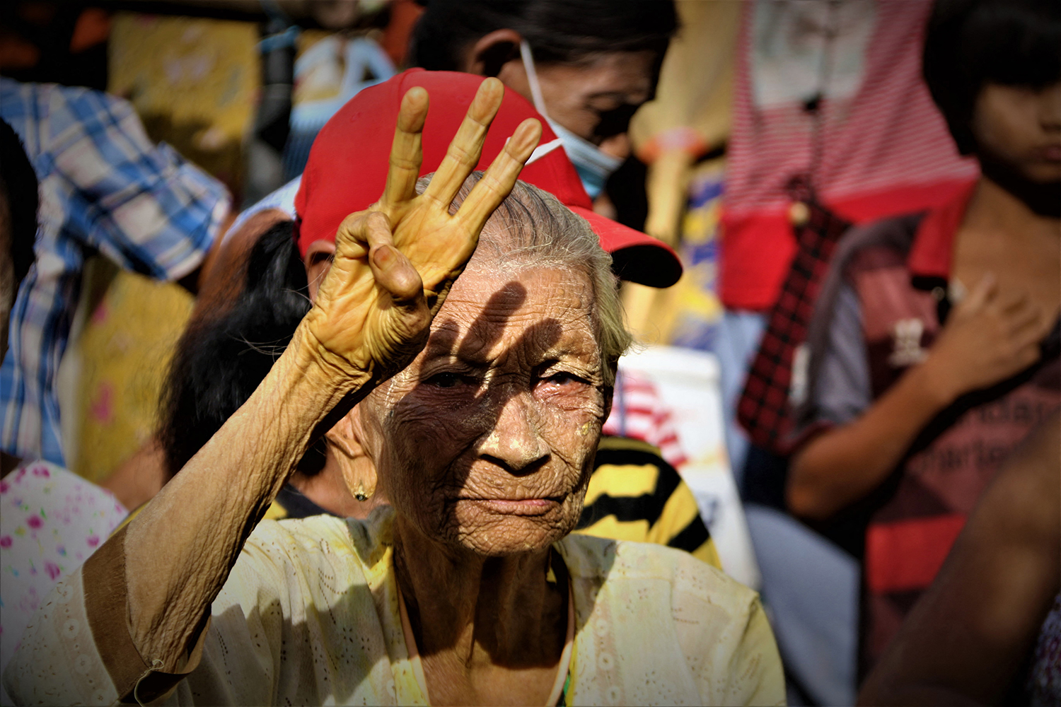 An elderly protester takes part in a demonstration against the coup in Tanintharyi Region's Launglon Township on May 23, 2021. (DAWEI WATCH | AFP)