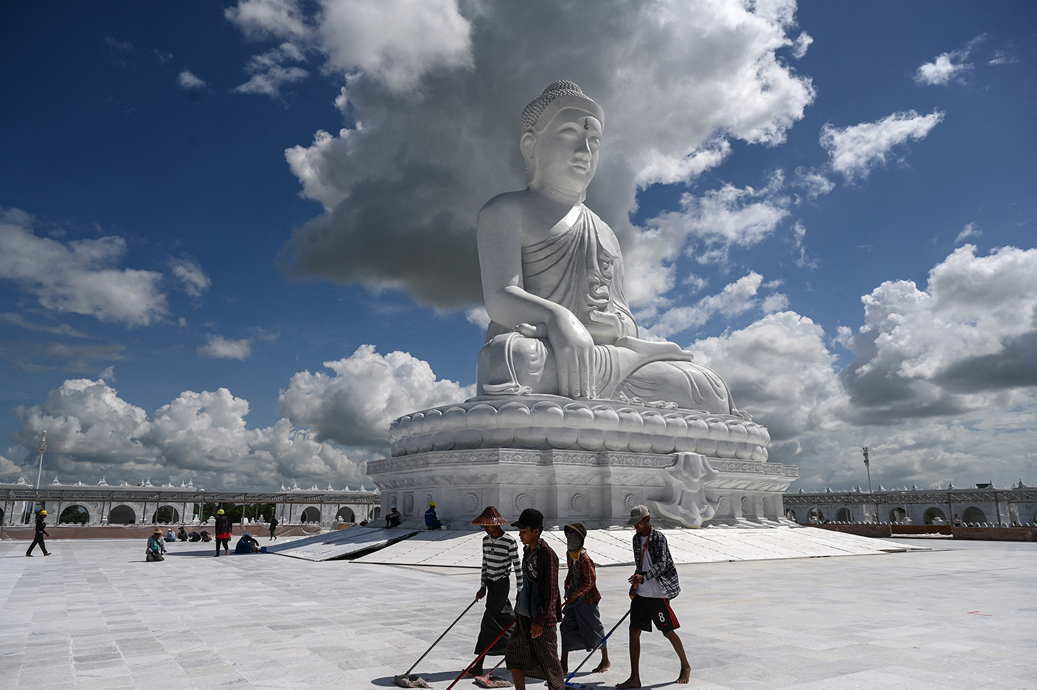 Workers prepare the area around the marble Maravijaya Buddha statue in Nay Pyi Taw on July 21, ahead of its opening on August 1. (AFP)