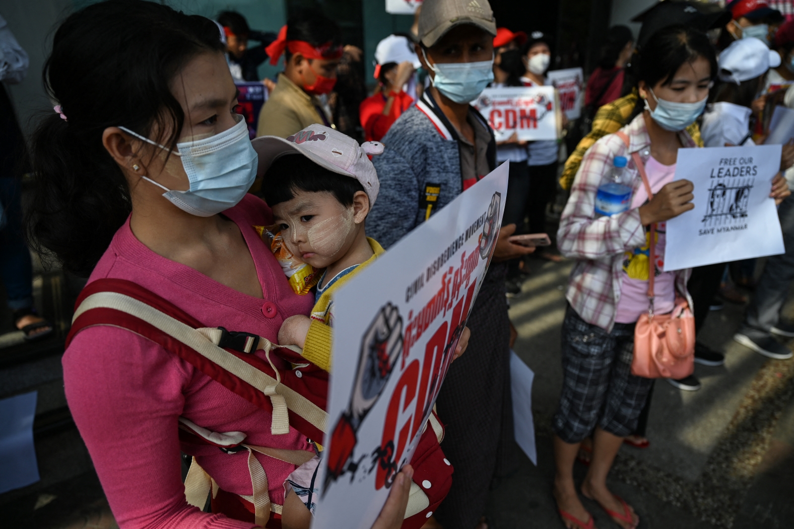 A protester holds a sign supporting the Civil Disobedience Movement at a demonstration against the coup in Yangon on February 14, 2021. (AFP)