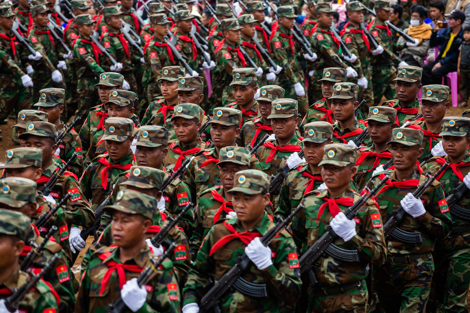 TNLA troops parade at a ceremony marking the 59th Ta'ang National Revolution Day in January 2022 in Shan State's Tangyang Township (Mar Naw | Frontier)