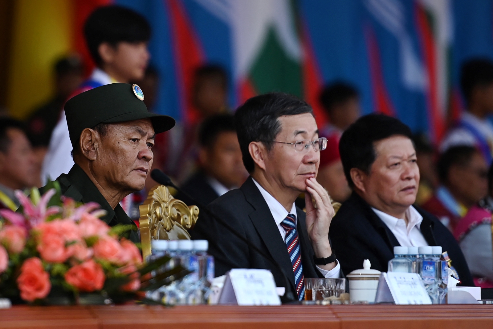 UWSA leader Bao Youxiang and China's special envoy for Asian affairs Sun Guoxiang watch a military parade to commemorate 30 years of a ceasefire between the armed group and the Myanmar military in the UWSA headquartes of Panghsang on April 17, 2019. (AFP)
